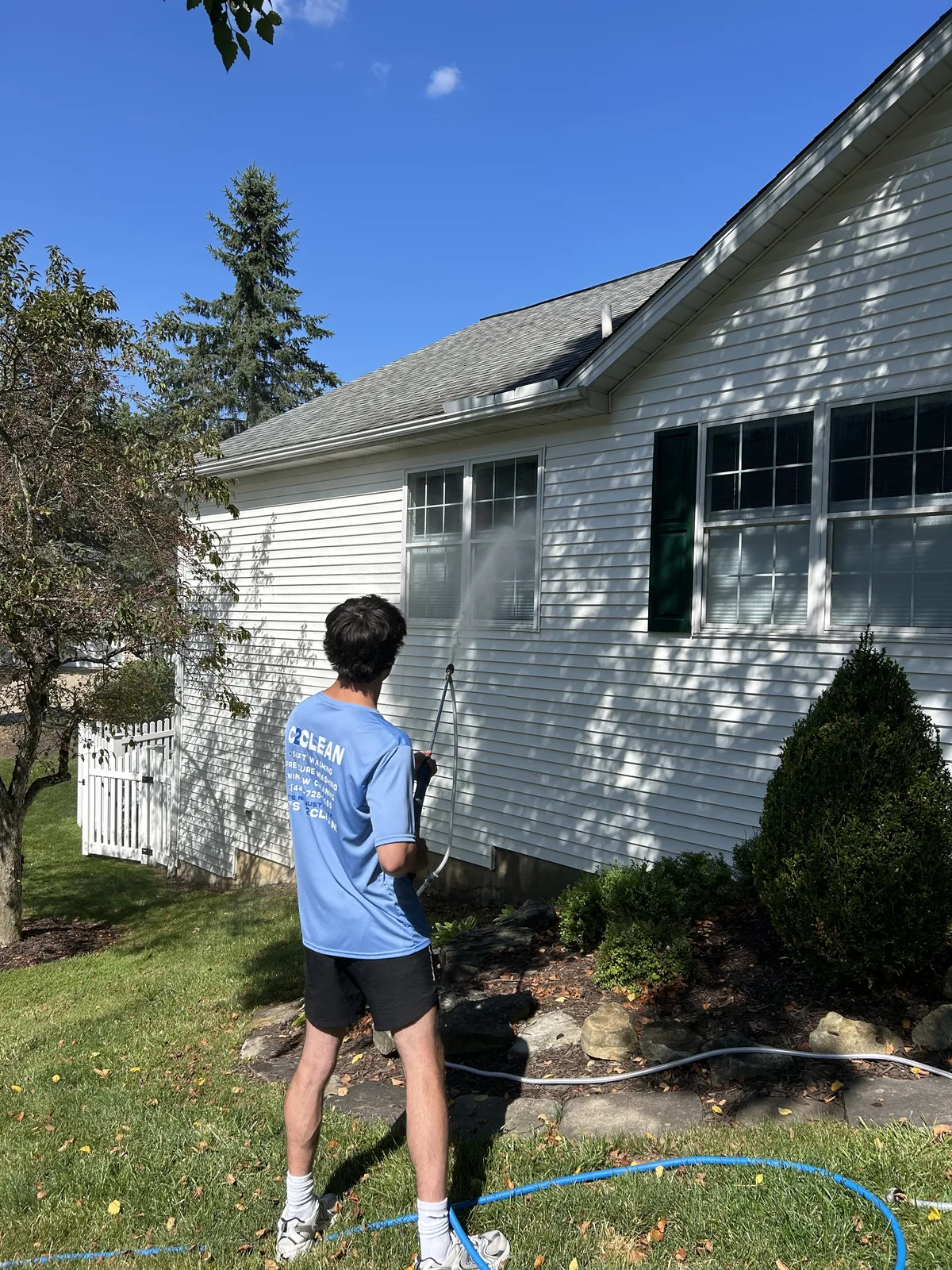 C2Clean Carter pressure washing a house in Aurora OH